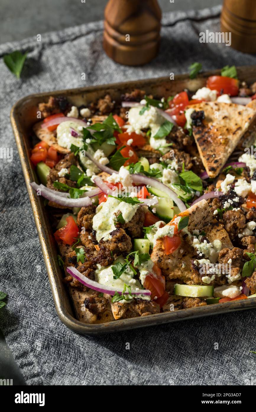 Mediterranean Homemade Pita Nachos with Lamb Hummus Feta and Cucumber