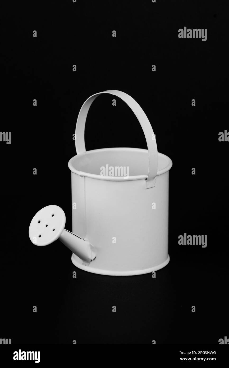 Pouring water with can Black and White Stock Photos & Images Alamy