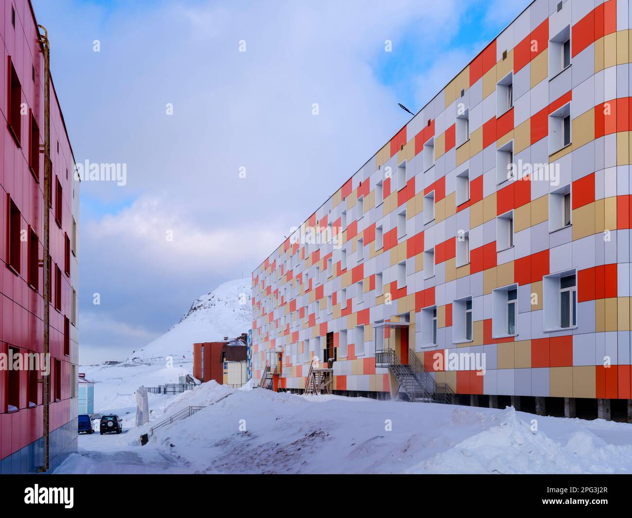 Residential area for the miners. Russian coal mining town Barentsburg at fjord Groenfjorden, Svalbard. The coal mine is still in operation. Arctic Reg Stock Photo