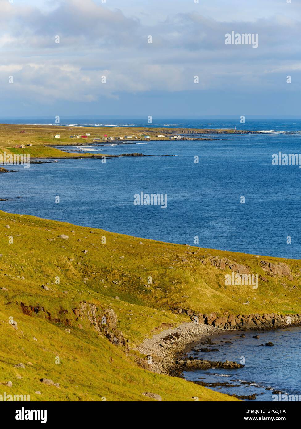 Village Gjoegur at the mouth of fjord Reykjarfjoerdur. The Westfjords ...