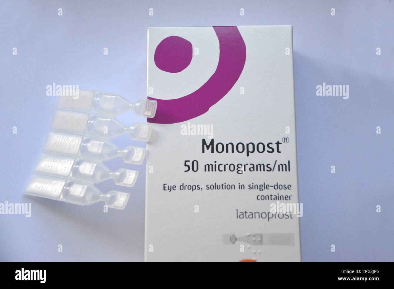 A Box of Monopost (Latanoprost) 50 mcg/ml Eye Drop Solution in single-dose Containers by Thea to Treat Open Angle Glaucoma and Ocular Hypertension. Stock Photo