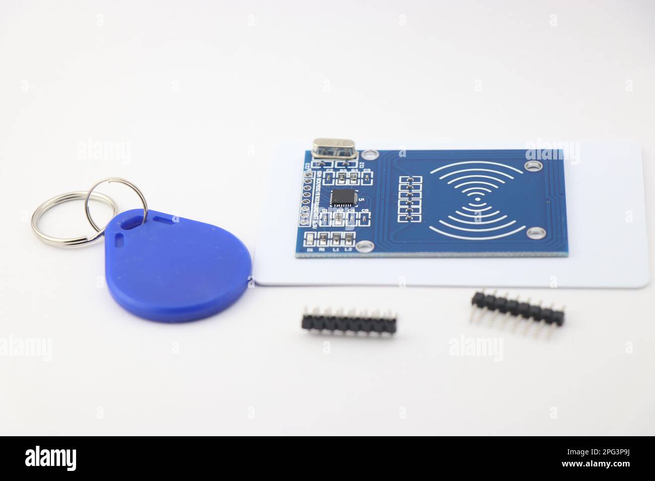 RFID chip sensor with its key tag and Pins for soldering on the board Stock Photo