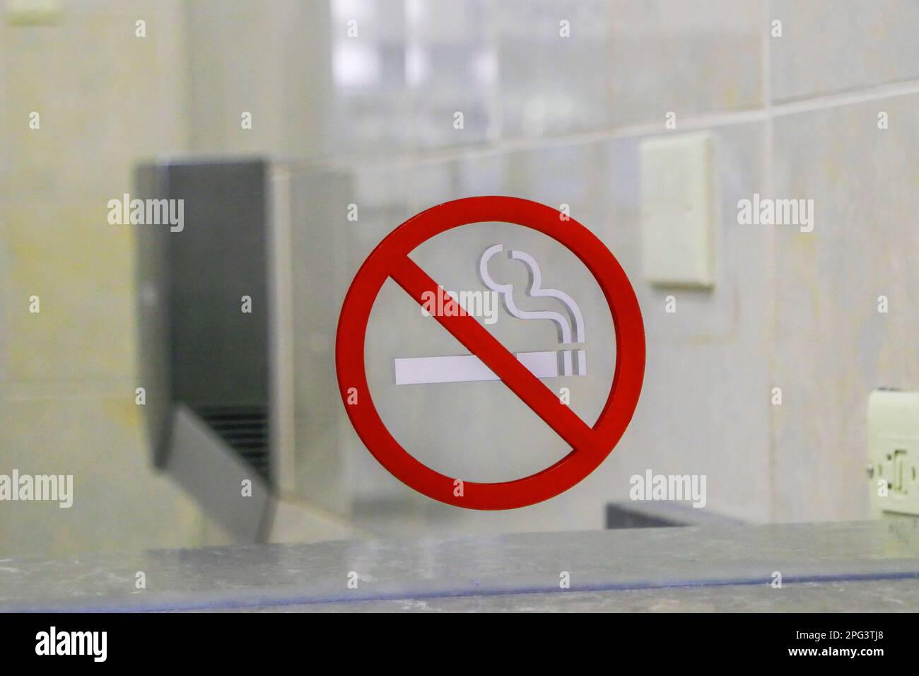 No Smoking sign inside a public women's bathroom inside a shopping mall. Stock Photo