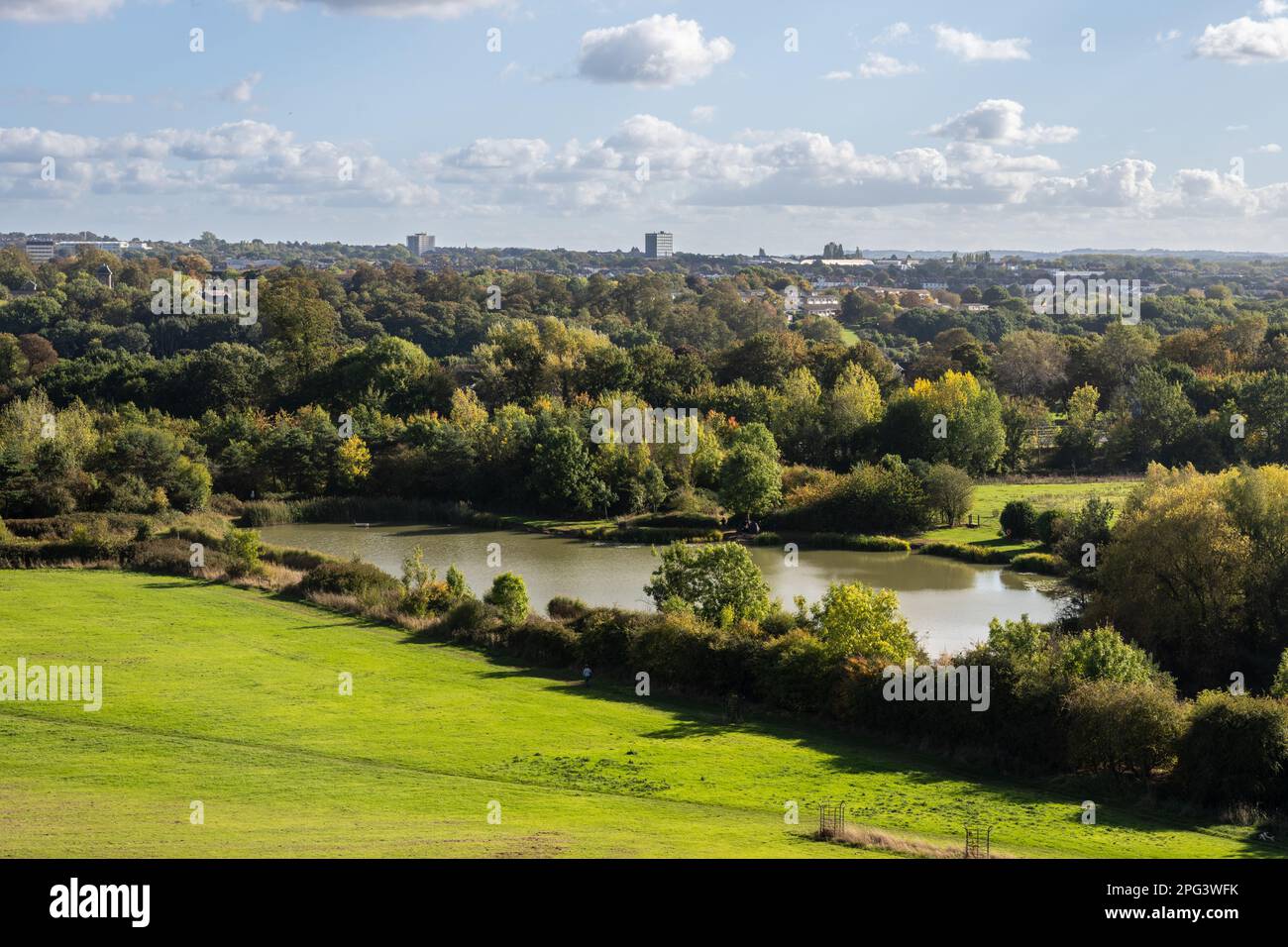 The view looking down on Duchess Pond and the suburbs of north east Bristol from Purdown hill in Stoke Park. Stock Photo
