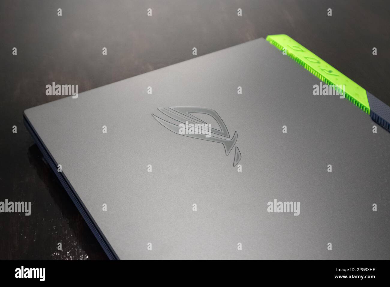 Kiev, Ukraine - August 28, 2022: ROG Strix G17 (Republic of Gamers) Gaming Laptop by ASUS close-up on table. Gaming grey notebook on black. Tech, IT, Stock Photo
