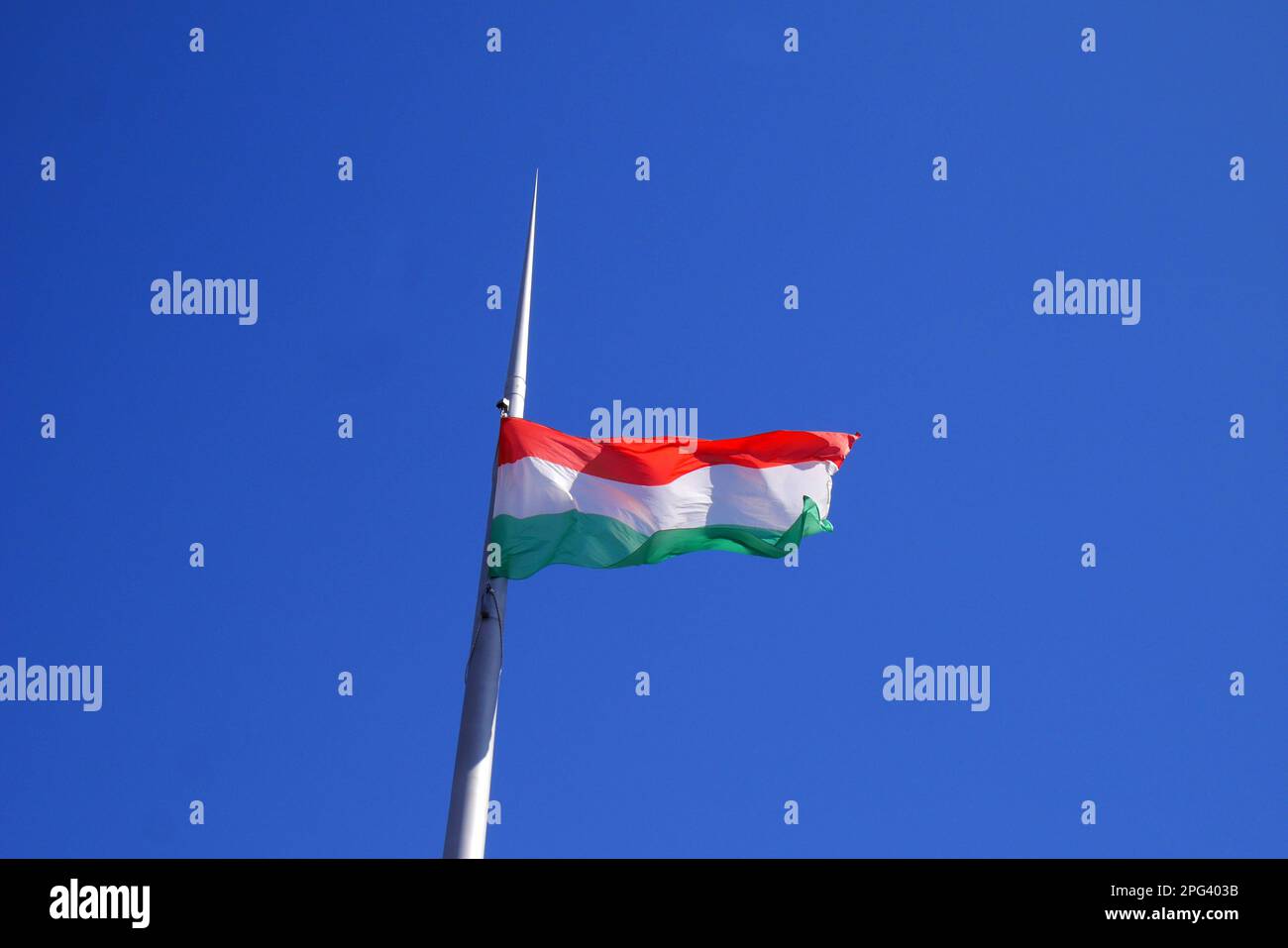 Hungarian flag flying in Kossuth ter outside the Hungarian Parliament building in Budapest Stock Photo