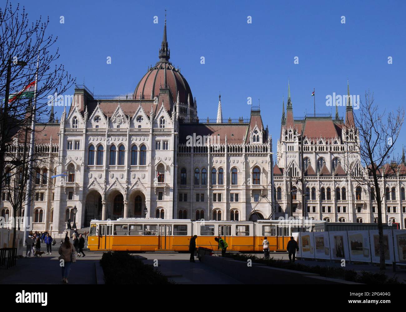 A tram runs past the neo-gothic Parliament building in Kossuth ter, Kossuth Square, designed by Imre Steindl in 1885, Budapest, Hungary Stock Photo