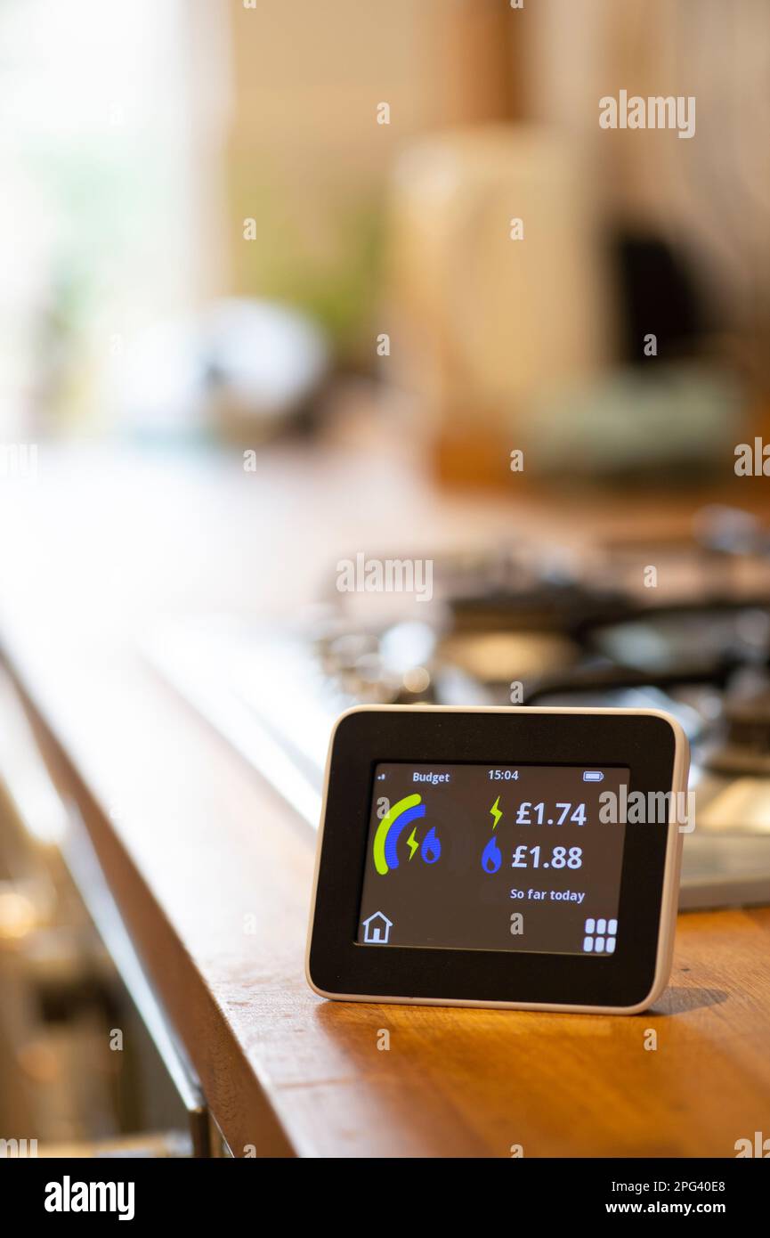 domestic energy smart meter on a kitchen work top showing the amount of energy used in pounds sterling Stock Photo