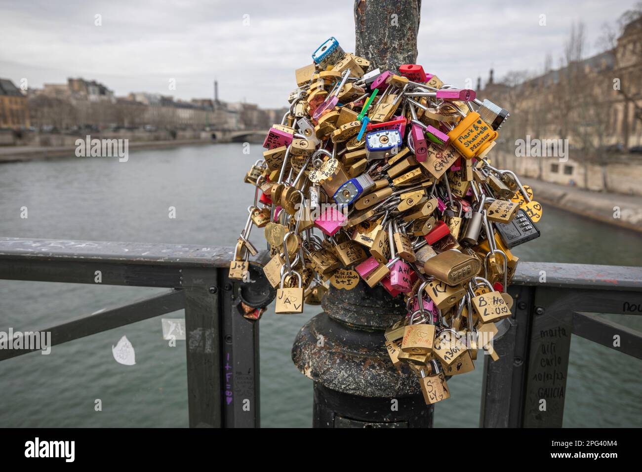 Padlocks attached to bridge over the River Seine, Paris, France, Europe