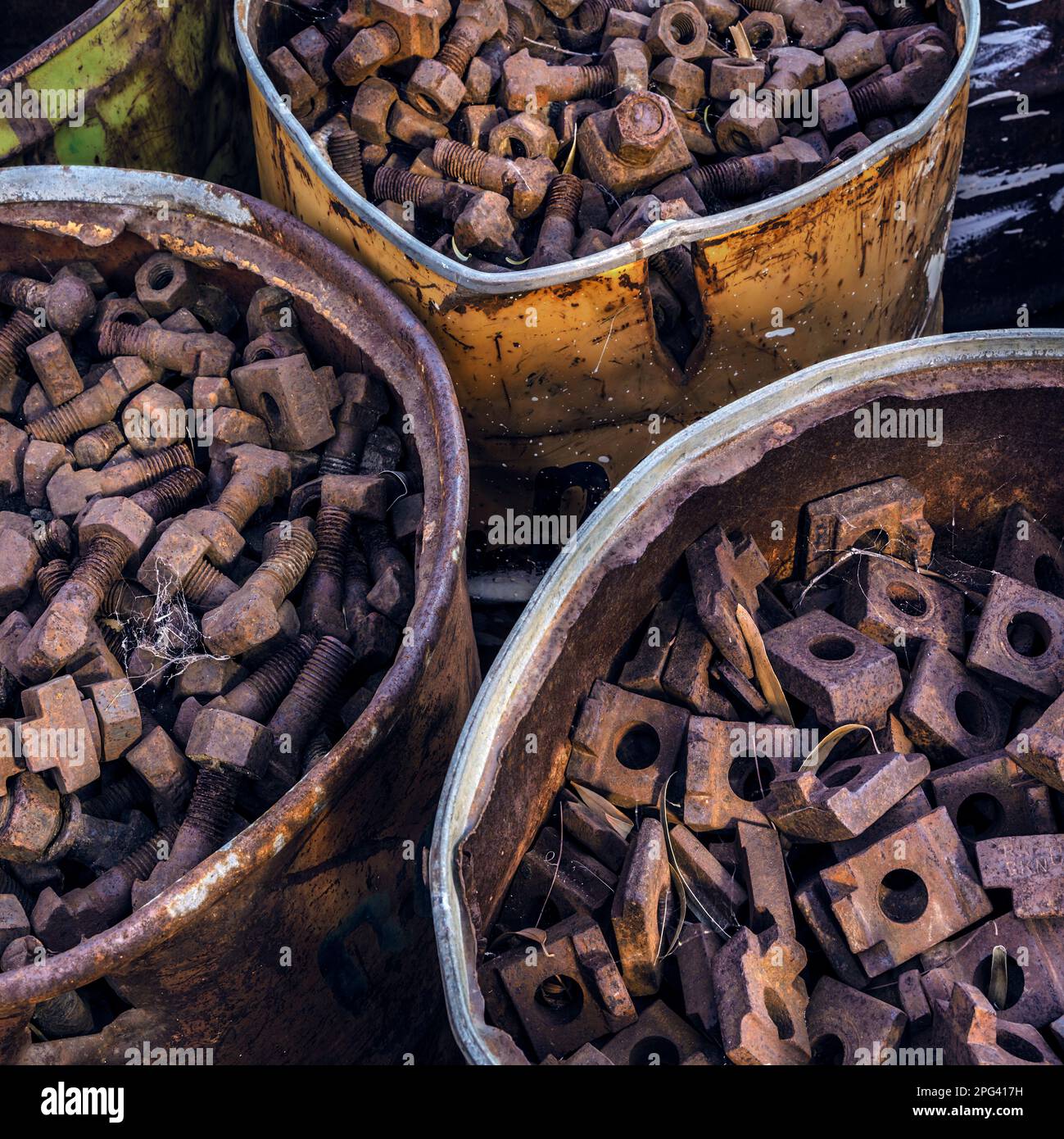Raiway line bolts and nuts lie in drum at the yard of the Aus Station