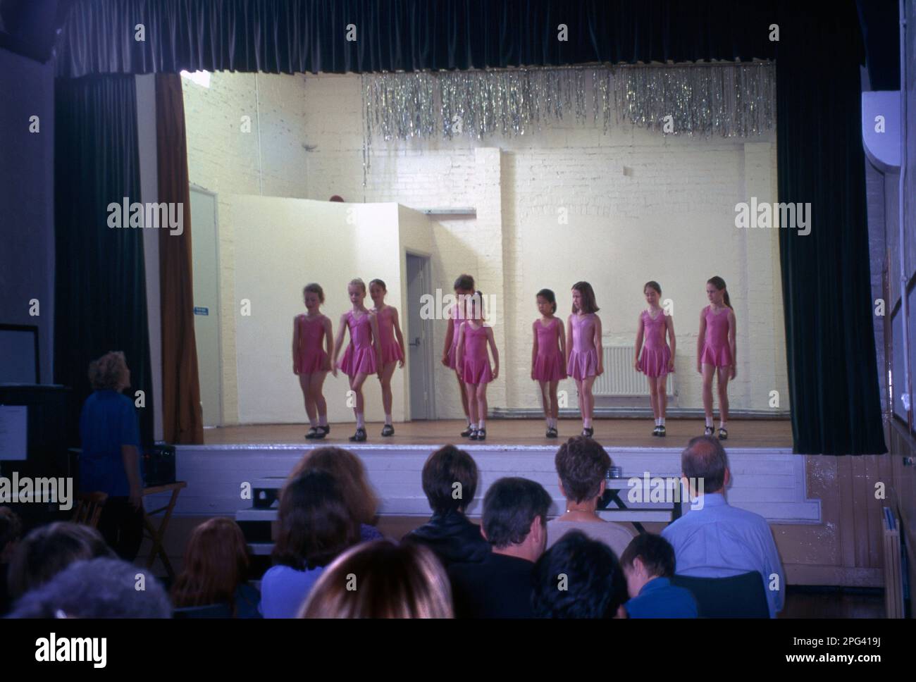 Audience watching Children's Tap Dancing Performance on Stage Surrey England Stock Photo