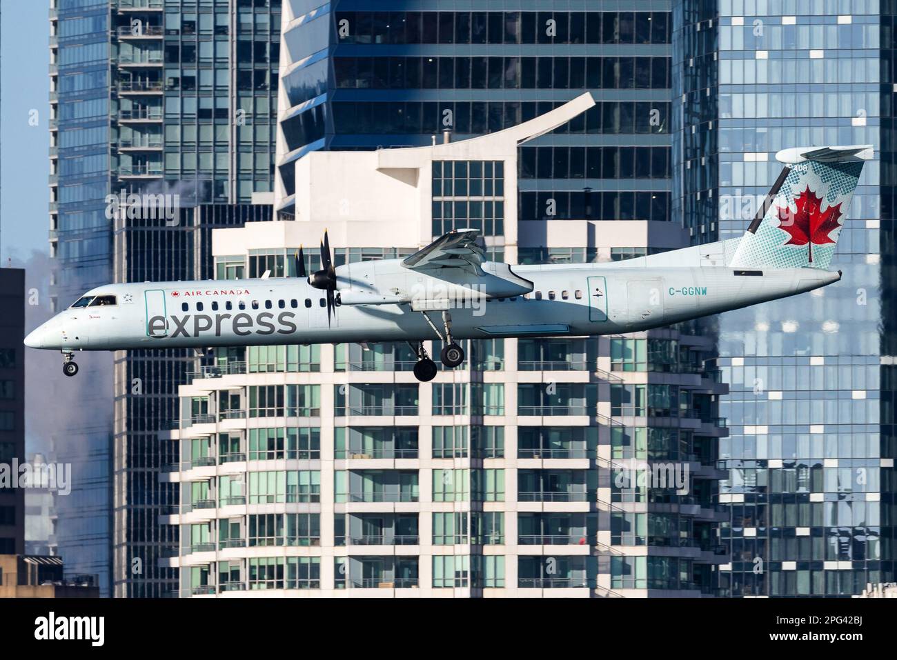 Air Canada Express DH8 Q400 Landing in Toronto City Airport Stock Photo