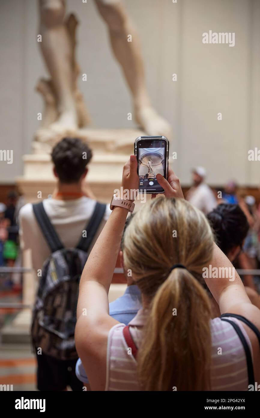 People photographing the statue of David, Galleria dell'Accademia, Florence, Italy Stock Photo