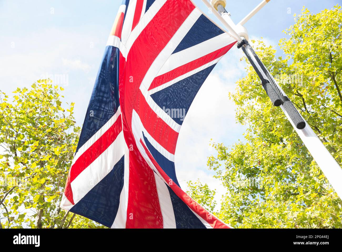 Union flag decorations on The Mall in London as people gather around Buckingham Palace on the 1st Saturday since the funeral of Queen Elizabeth II. Stock Photo