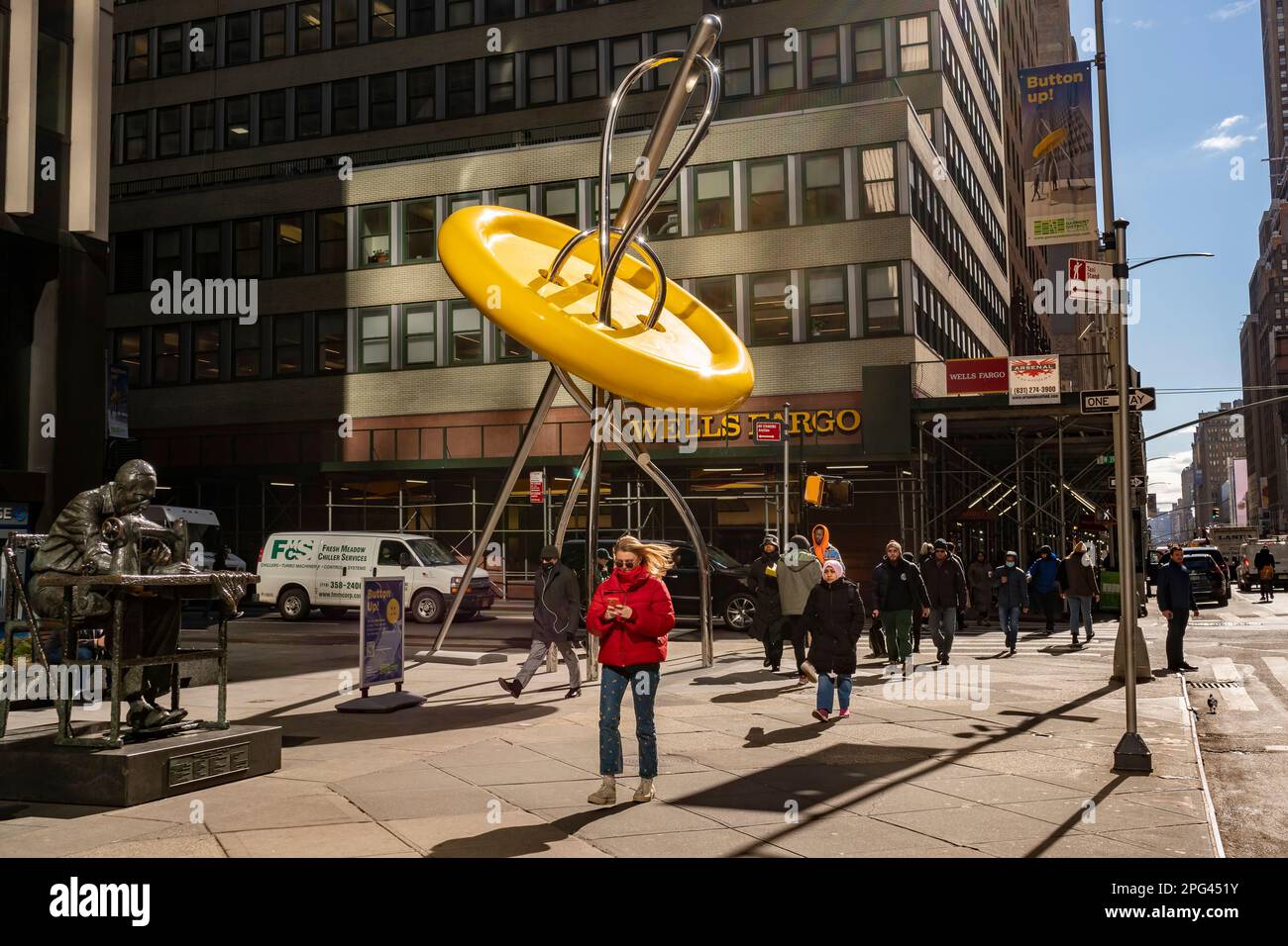 The recently renovated and unveiled ÒBig Button in the Garment District in New York on Wednesday, March 8, 2023. The former Big Button with an accompanying information kiosk was constructed in 1996 and had outlived its usefulness but the Big Button sculpture was very popular. The new sculpture is made of new materials, has better sightlines and the buttonÕs bright yellow color is the color of New York taxis. (© Richard B. Levine) Stock Photo