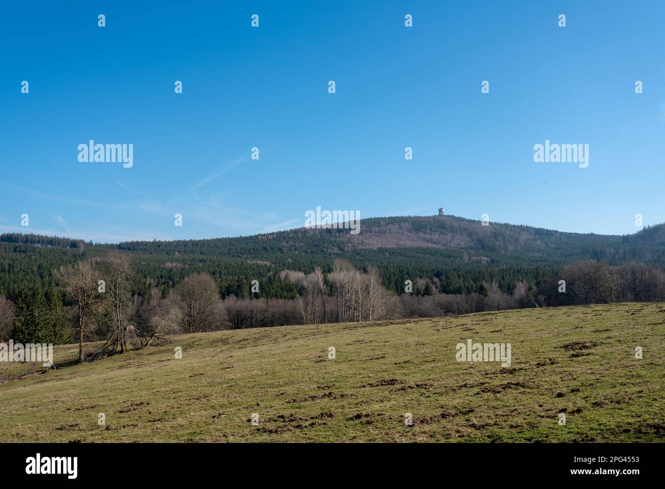 Velký Zvon (Plattenberg) hill with a military installation as seen from the area of former village Walddorf, Upper Palatine Forest, Czech republic. Stock Photo