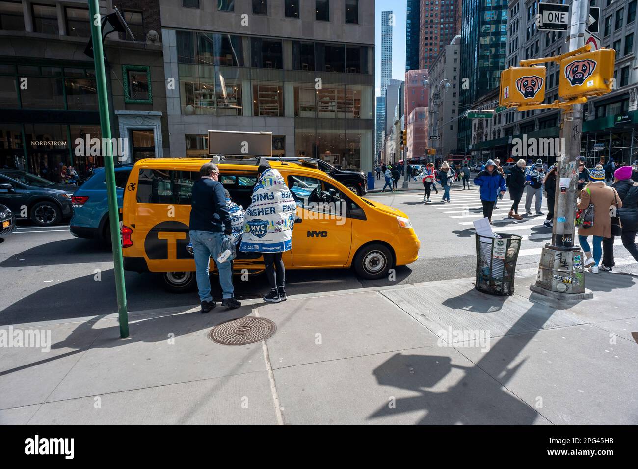 Finishers in the United Airlines HalfMarathon wander about Midtown