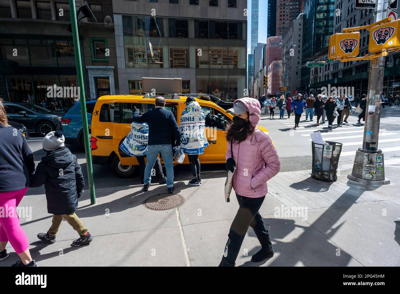 Finishers in the United Airlines HalfMarathon wander about Midtown