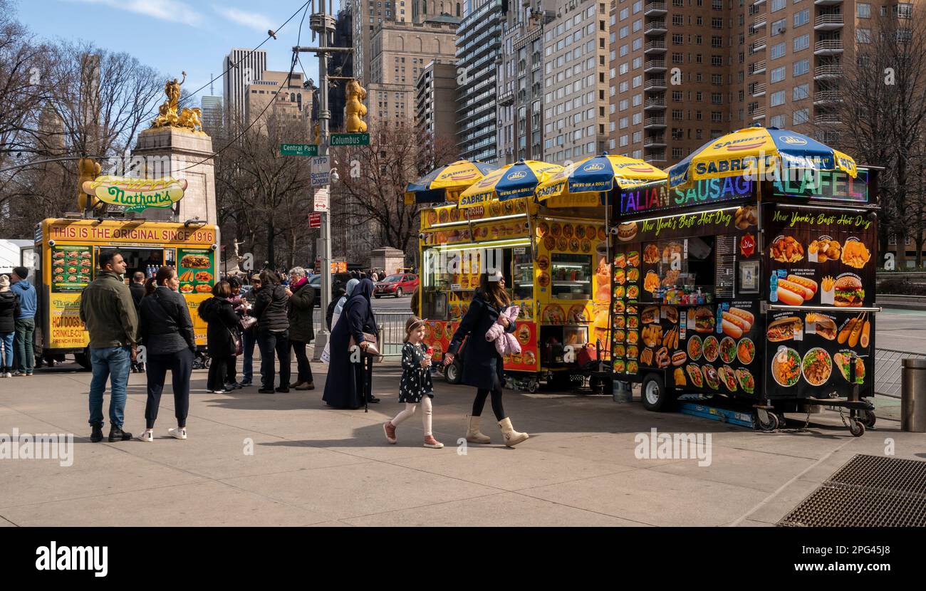 Hot dog vendors and other street food in Columbus Circle in New York on Saturday, March 18, 2023. (© Richard B. Levine) Stock Photo