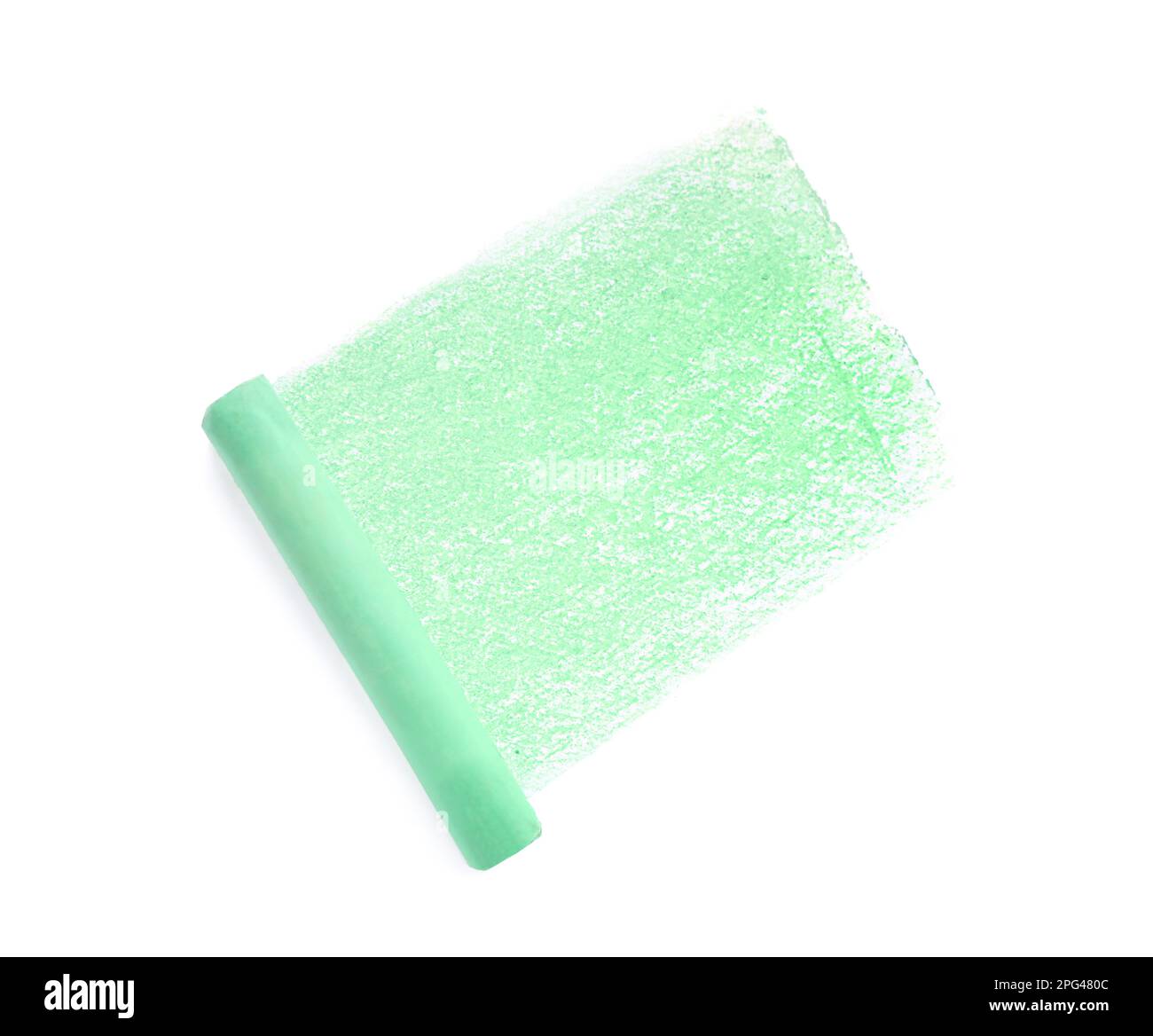 Green pastel chalk on sheet of paper with scribble, top view. Drawing