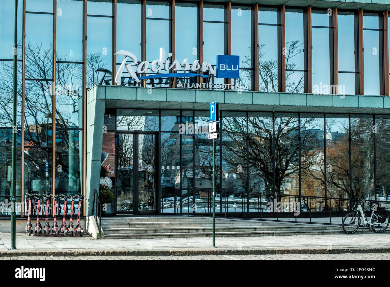 Stavanger, Norway, March 10 2023, Downtown Stavanger Radisson Blu Atlantic Hotel Entrance Modern Architecture Glass Facade With Window Reflections Stock Photo