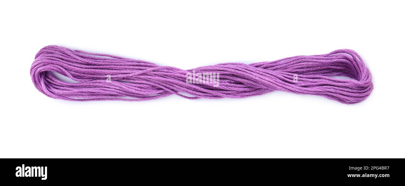 Bright violet embroidery thread on white background Stock Photo - Alamy