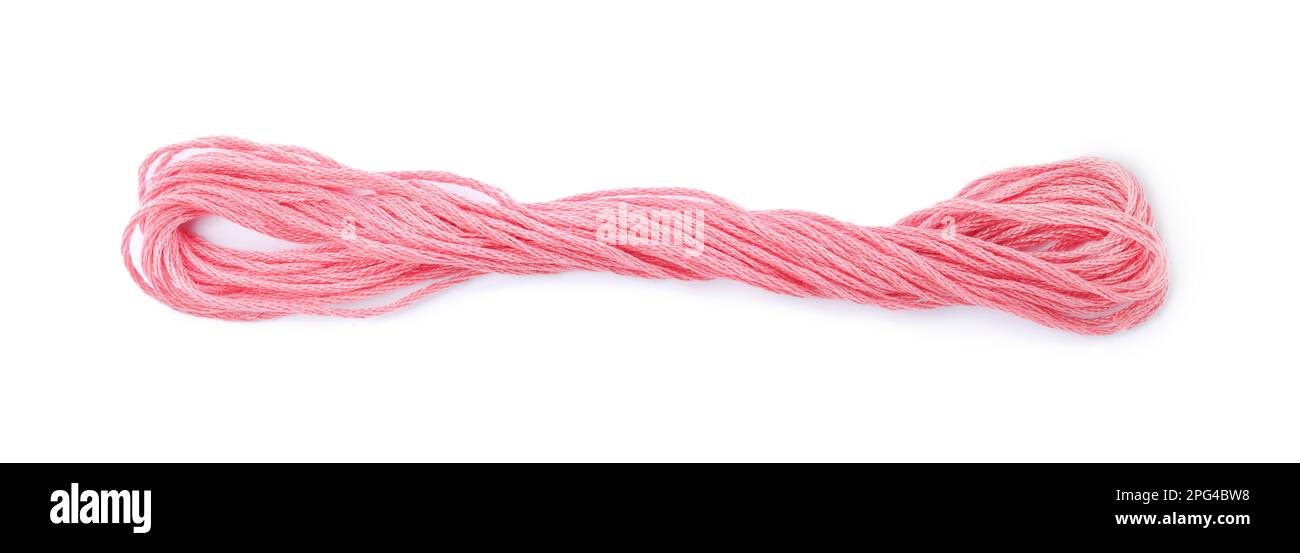 Bright pink embroidery thread on white background Stock Photo - Alamy