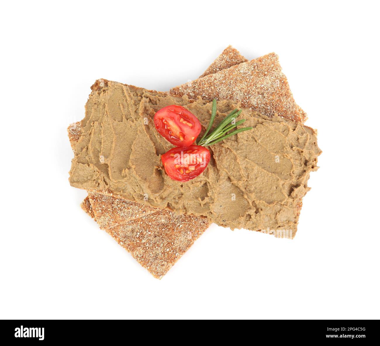 Crispy crackers with tasty liver pate, tomato and rosemary on white background, top view Stock