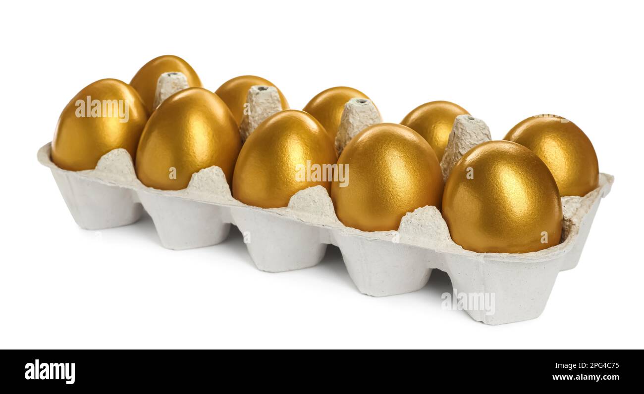 Many shiny golden eggs in carton on white background Stock Photo Alamy