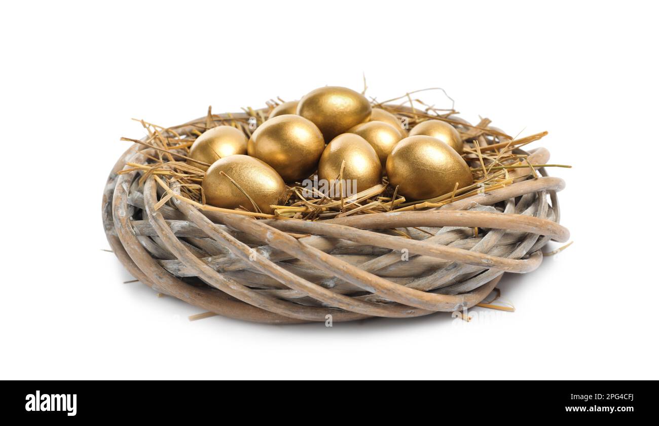 Shiny golden eggs in nest on white background Stock Photo - Alamy