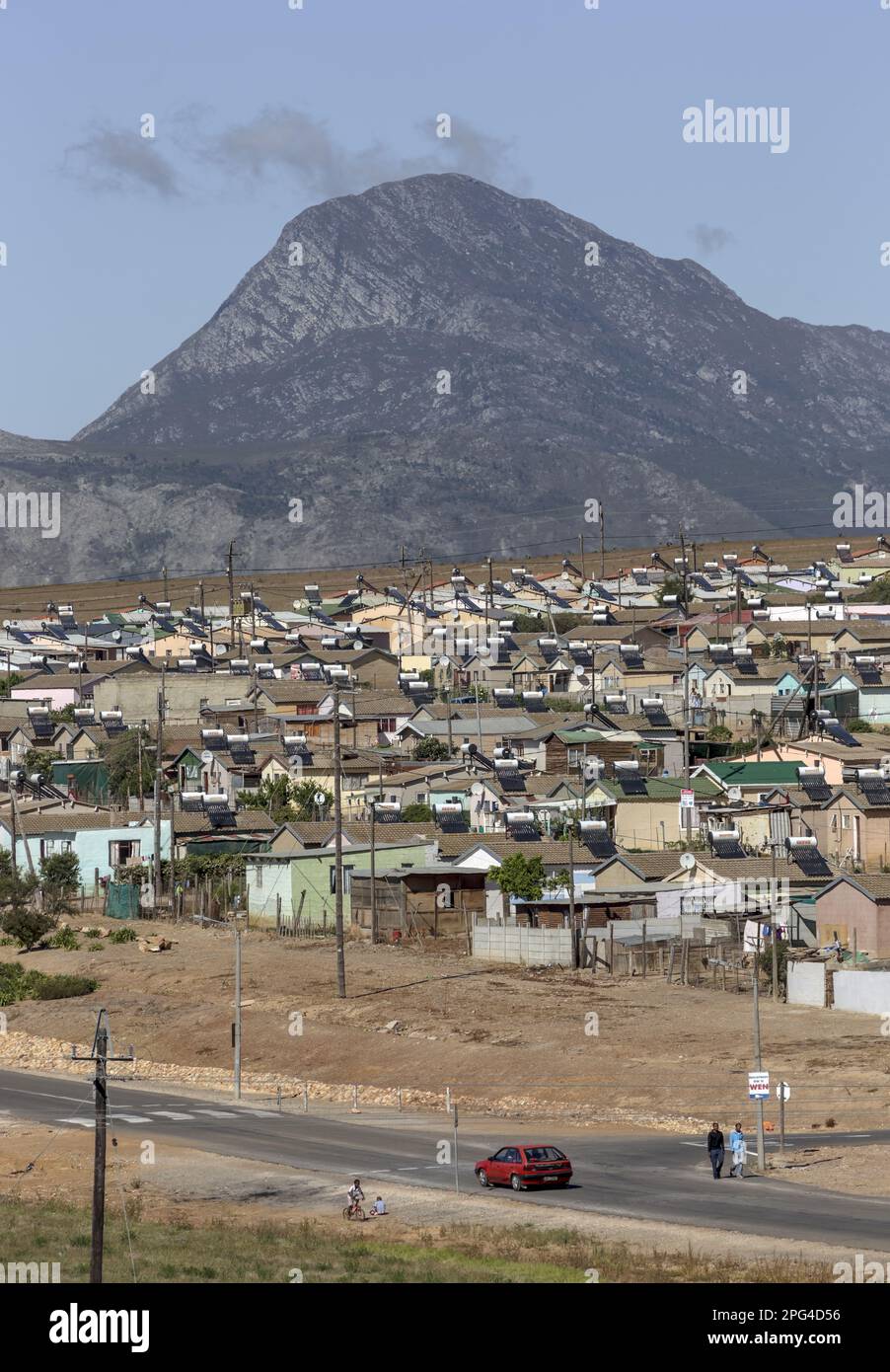 A recent government housing project extends across a hill outside the
