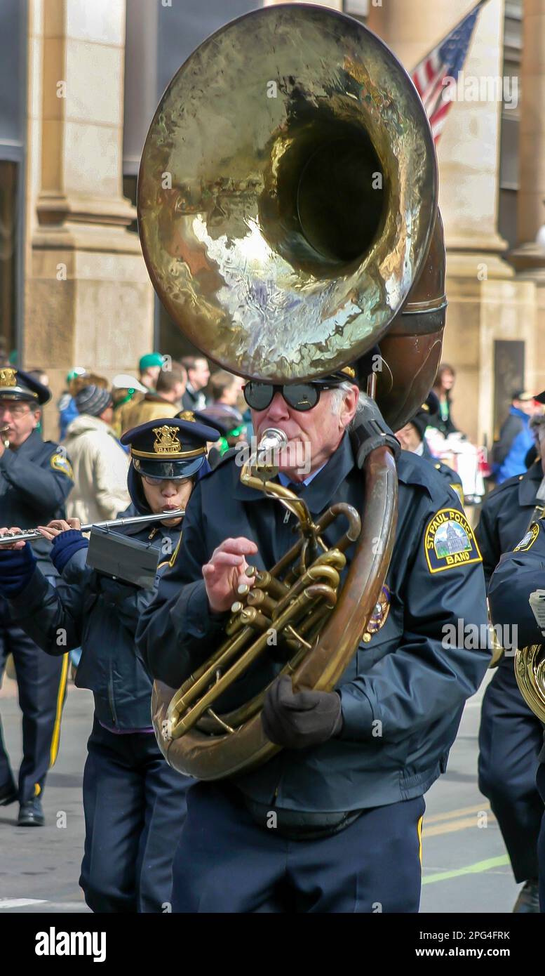 Sousaphone tuba player in the St. Paul Police Band at the Patrick’s Day parade in Saint Paul, Minnesota, 2005. Saint Paul has been celebrating annuall Stock Photo
