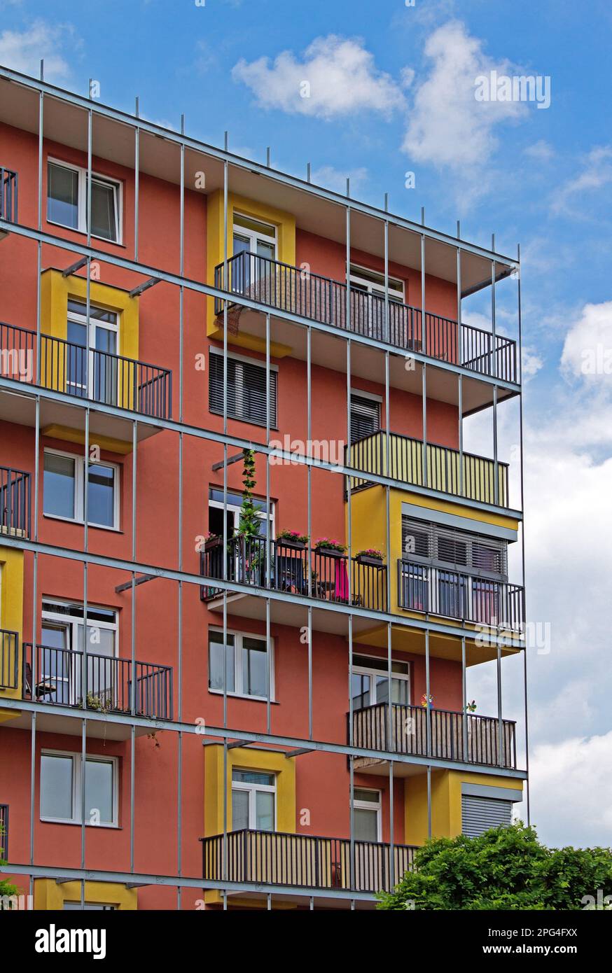 Modern apartments and housing with balconies and red walls Stock Photo ...