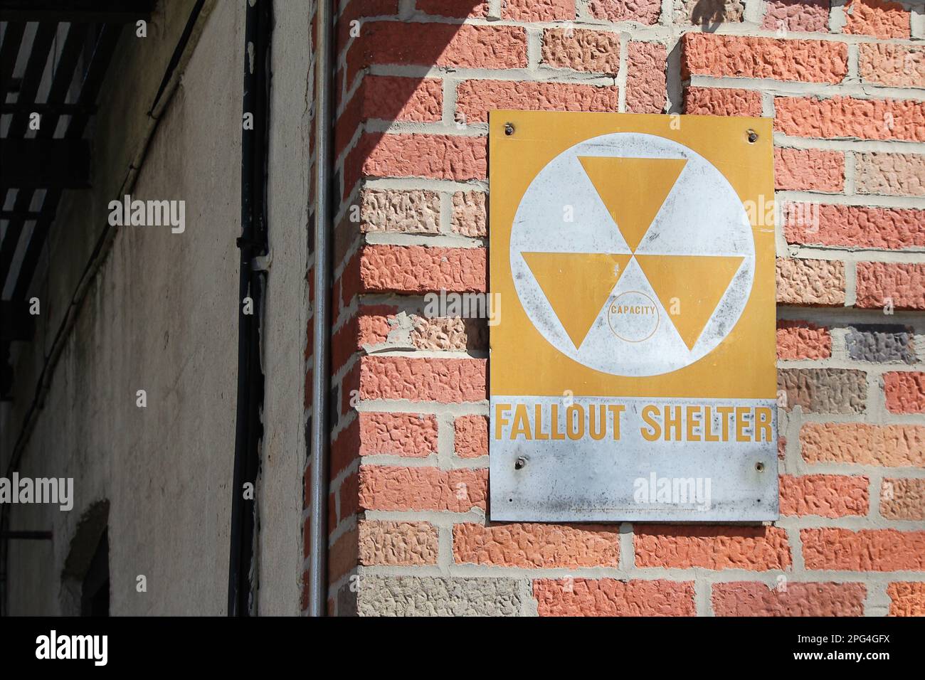 Classic nuclear radiation symbol on New York City building fallout shelter Stock Photo