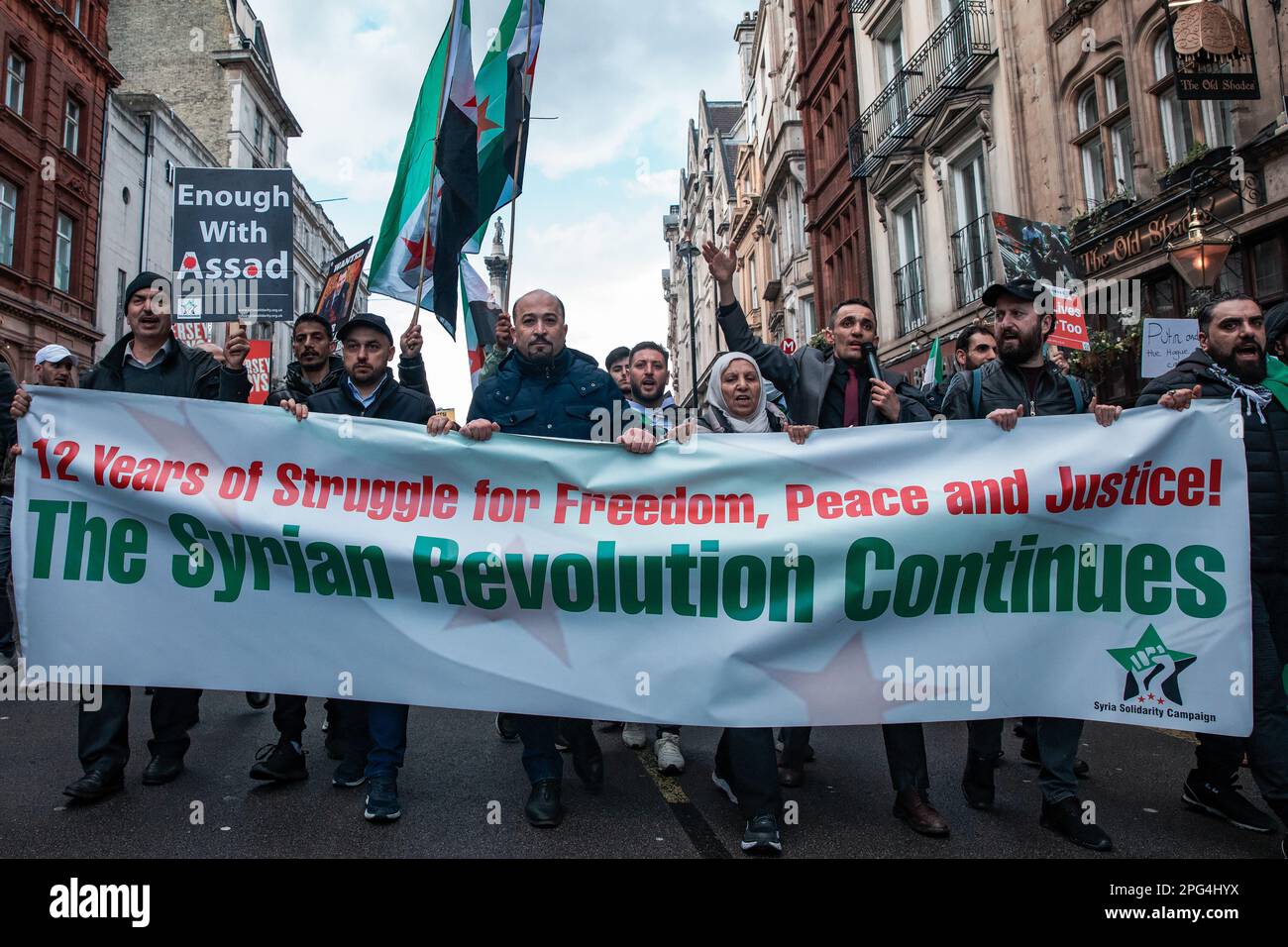 London, UK. 18th March, 2023. Supporters of Syria Solidarity Campaign (SSC) march along Whitehall behind a banner to mark the 12th anniversary of the Syrian Revolution. The UK-based Syria Solidarity Campaign is a network of activists and supporters committed to amplifying the voices of Syrians struggling for peace and a democratic and pluralist Syria. Credit: Mark Kerrison/Alamy Live News Stock Photo
