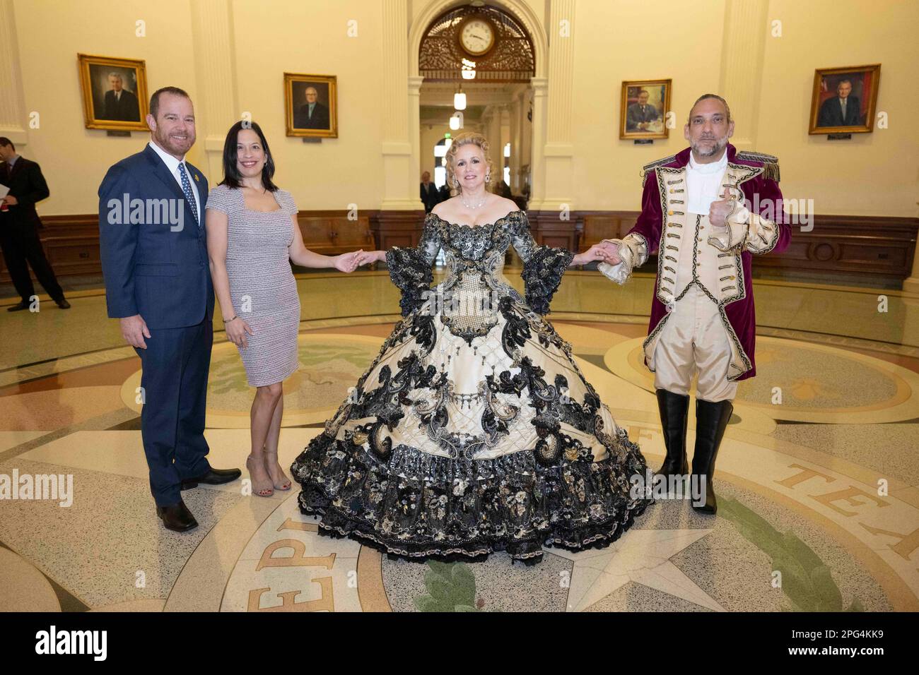 Texans from Laredo pose and parade through the Texas Capitol to promote