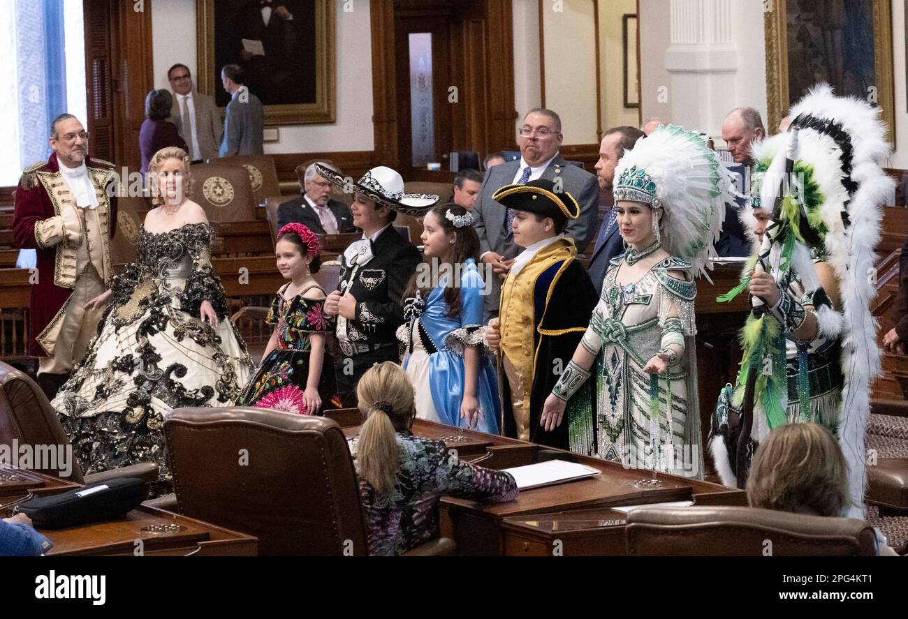 Texans from Laredo pose and parade through the Texas Capitol to promote