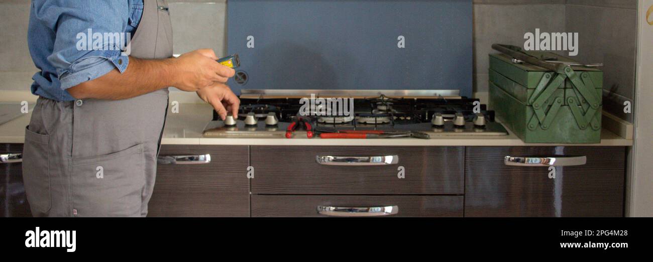 Image of a handyman technician who with a detector carries out checks