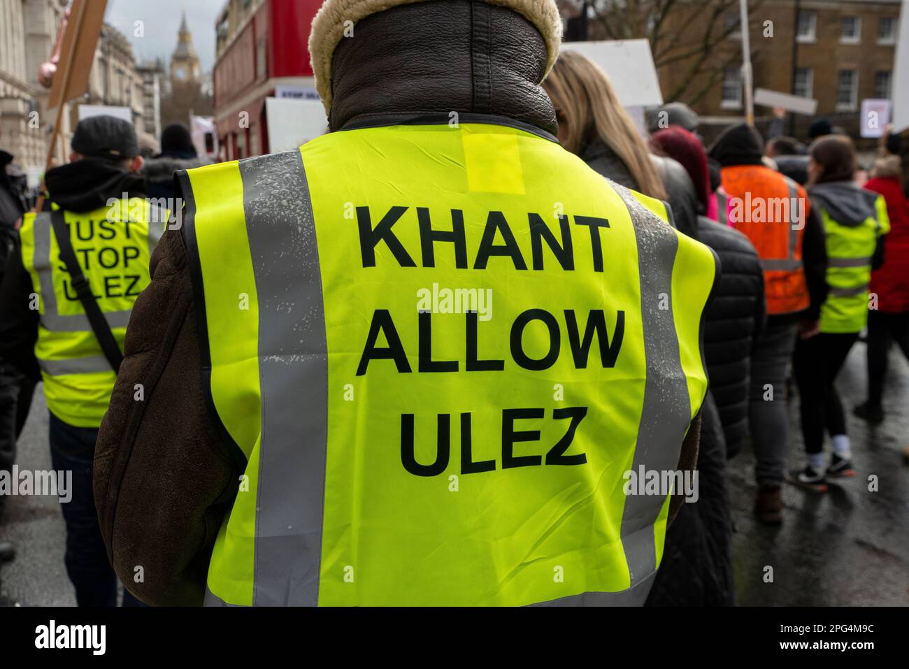 Protest against ULEZ zone expansion in London, UK. Yellow vest with reference to Sadiq Khan and Ulez Stock Photo