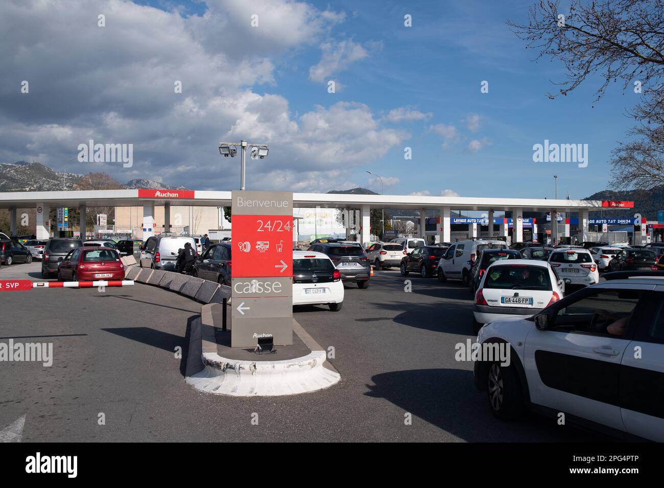 Aubagne, France. 20th Mar, 2023. Cars queue up at a Auchan gas station