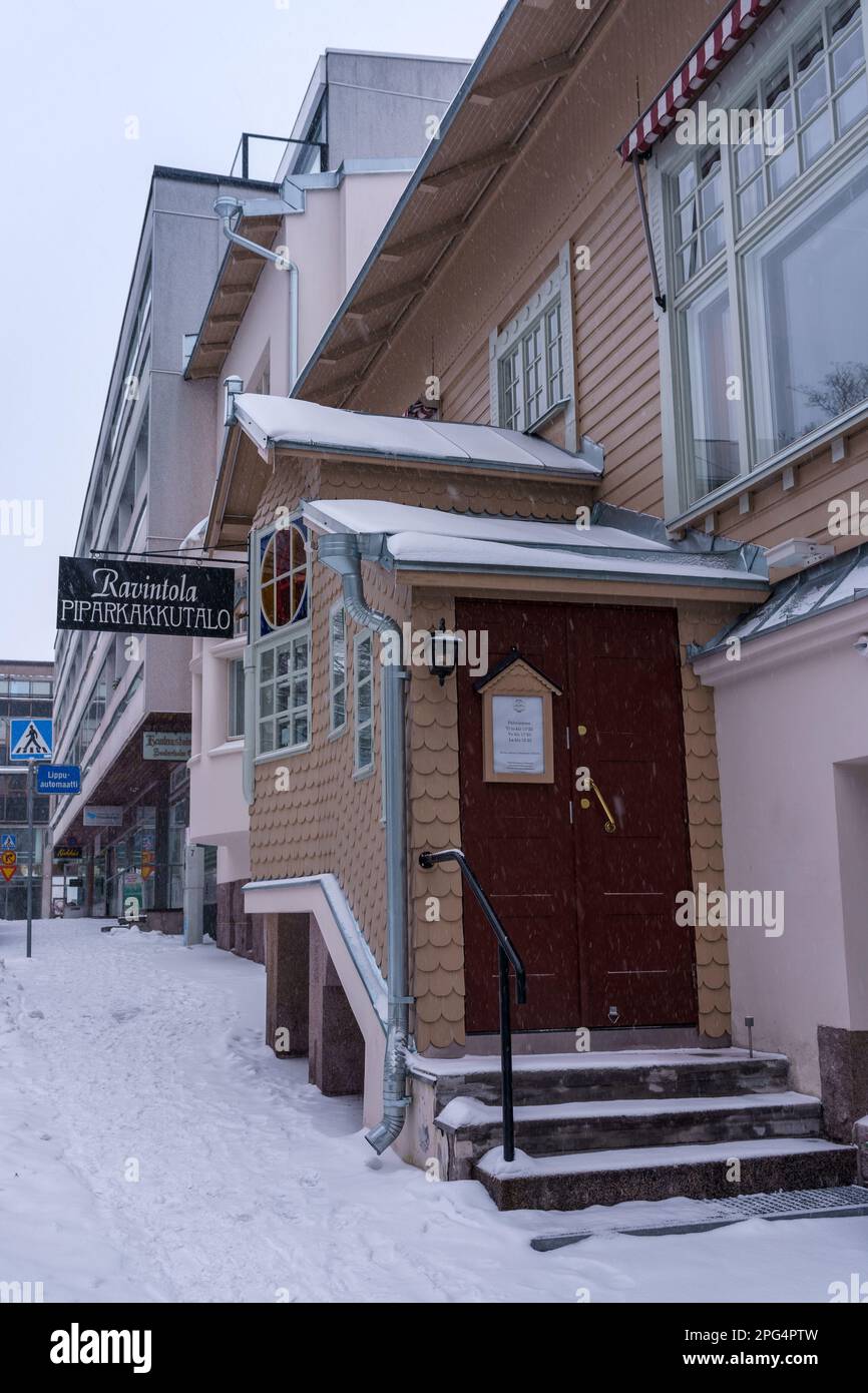 Entrance to the restaurant Piparkakkutalo (The Gingerbread House) in winter. Hameenlinna, Finland. February 23, 2023. Stock Photo