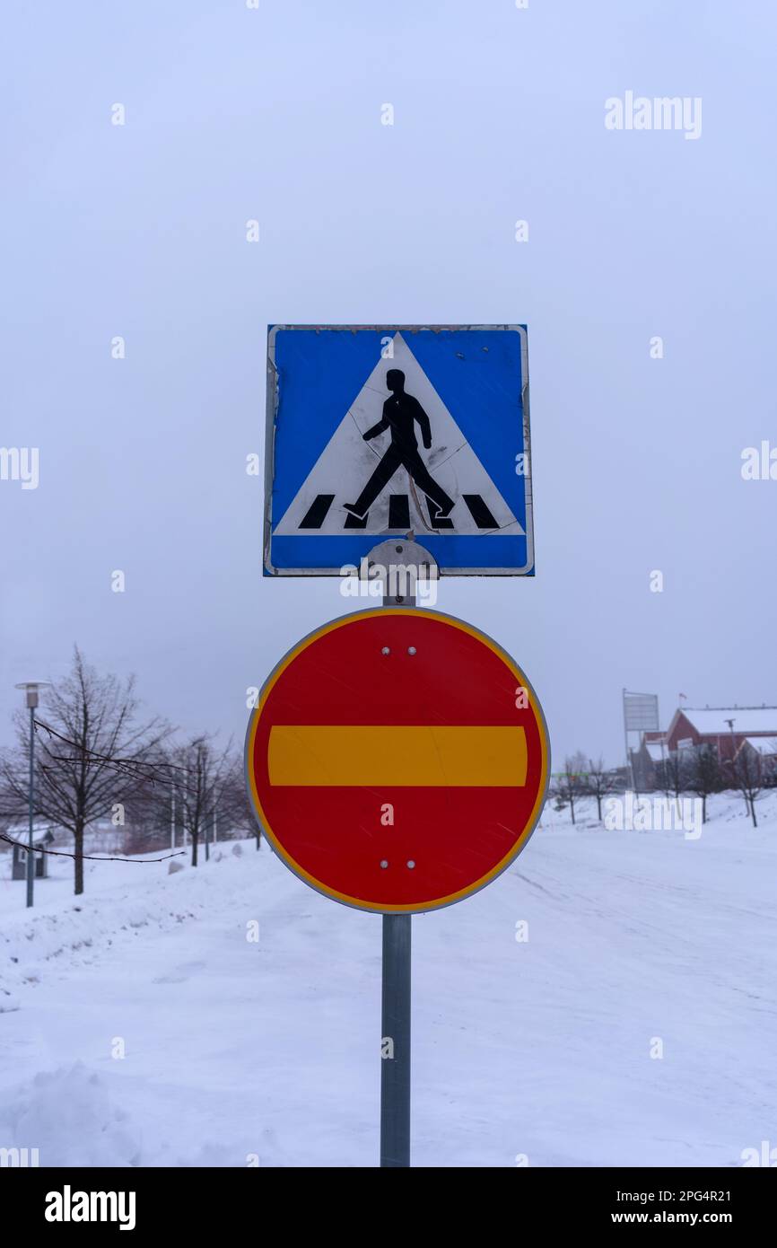 Pedestrian crossing and no entry signs with winter background in Finland Stock Photo