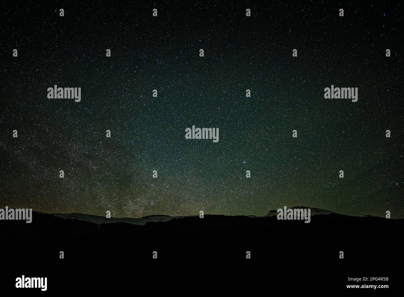Sky full of stars over the mountains. No light pollution. Dark sky park. Bieszczady Mountains, Poland. Stock Photo