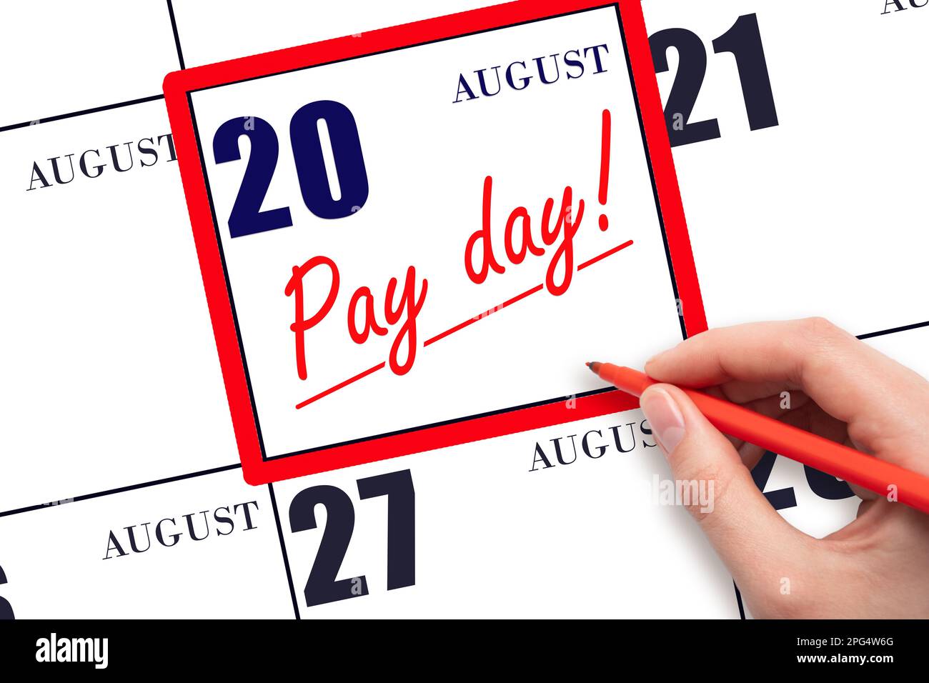 20th day of August. Hand writing text PAY DATE on calendar date August 20 and underline it. Payment due date. Reminder concept of payment. Summer mont Stock Photo