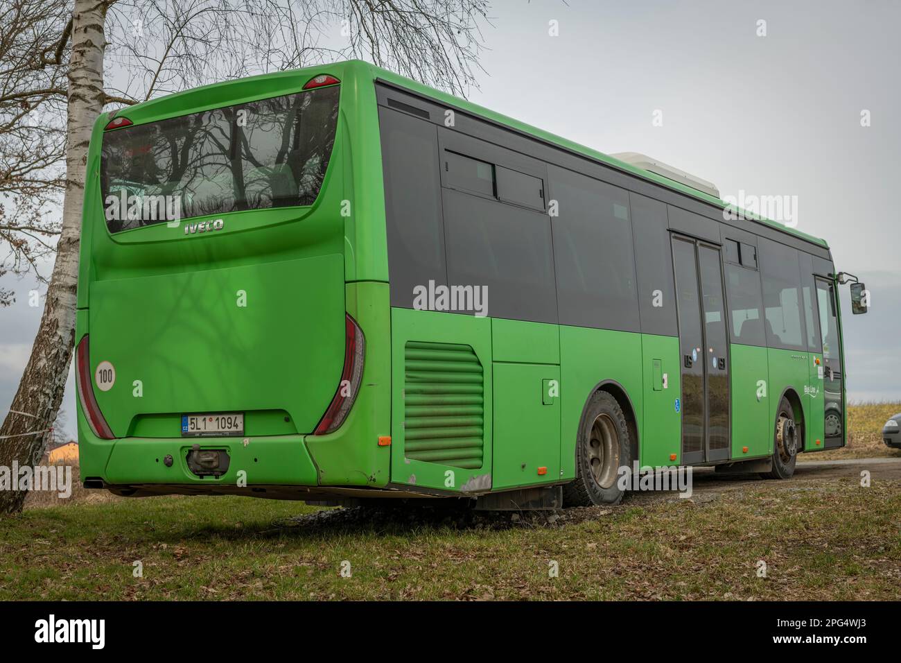 Green passenger bus parking in cloudy working day in Sobeslav 03 07
