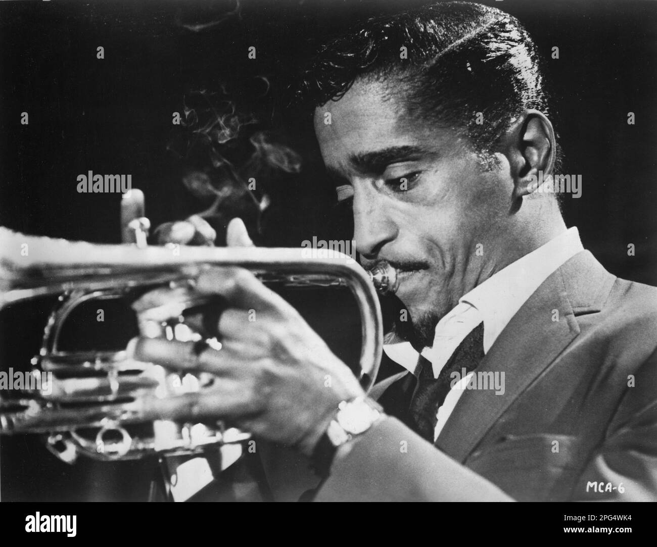 Sammy Davis Junior in his prime playing his trumpet with his Trademark cigarette in hand Stock Photo