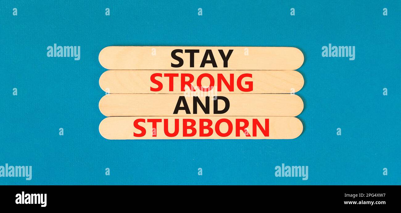 Stay strong and stubborn symbol. Concept words Stay strong and stubborn on wooden stick