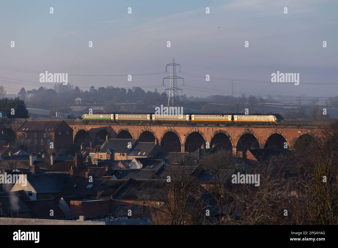 Open access operator Grand central class 180 train 180112 crossing Yarm Viaduct  with a Sunderland to London train Stock Photo