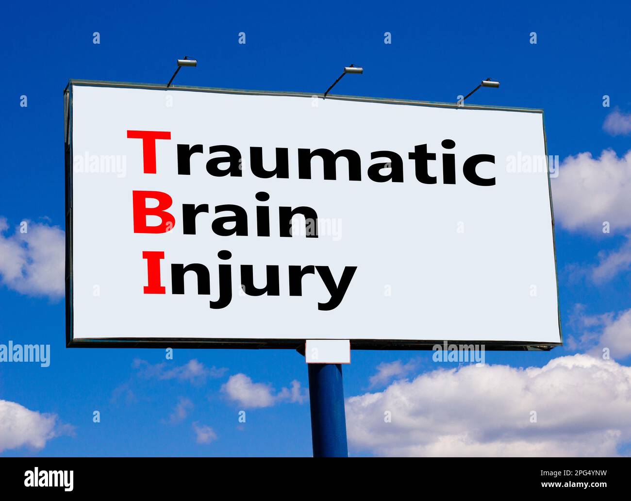 TBI traumatic brain injury symbol. Concept words TBI traumatic brain injury on big white billboard against beautiful blue sky background. Clouds. Medi Stock Photo