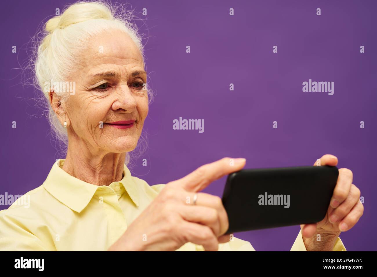 Elderly woman grey purple hair hi-res stock photography and images - Alamy